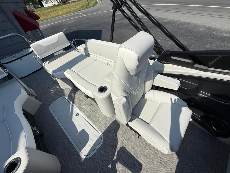 Slide: The Image of 2025 Avalon Catalina Quad Lounger with Shift Windshield, featuring luxurious white seating. - 19