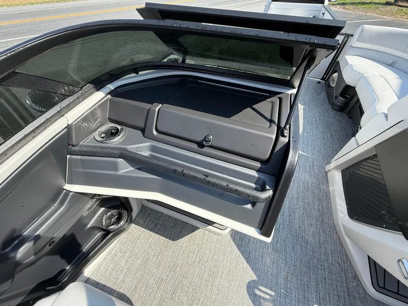 Slide: The Image of 2025 Avalon Catalina Quad Lounger with windshield, featuring sleek interior and seating. - 22