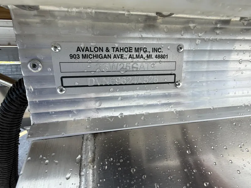 Slide: The Image of 2025 Avalon Catalina Quad Lounger Shift Windshield nameplate with raindrops, manufactured by Avalon & Tahoe Mfg. - 25