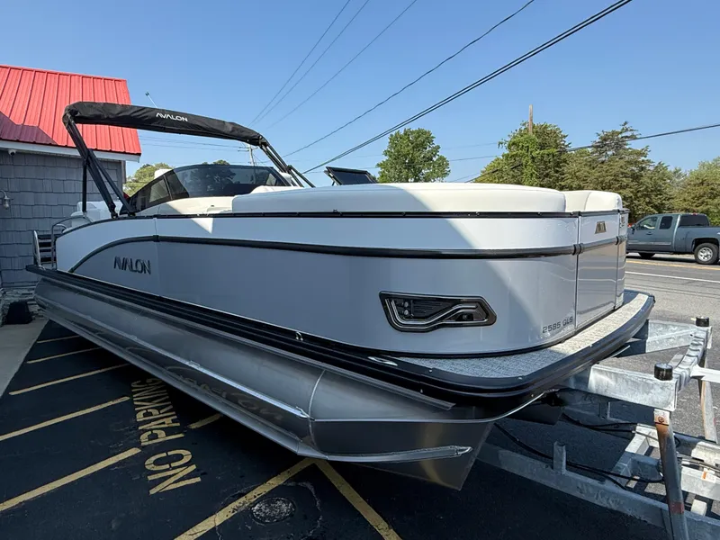 Slide: The Image of 2025 Avalon Catalina Quad Lounger Shift Windshield pontoon boat on trailer. - 8