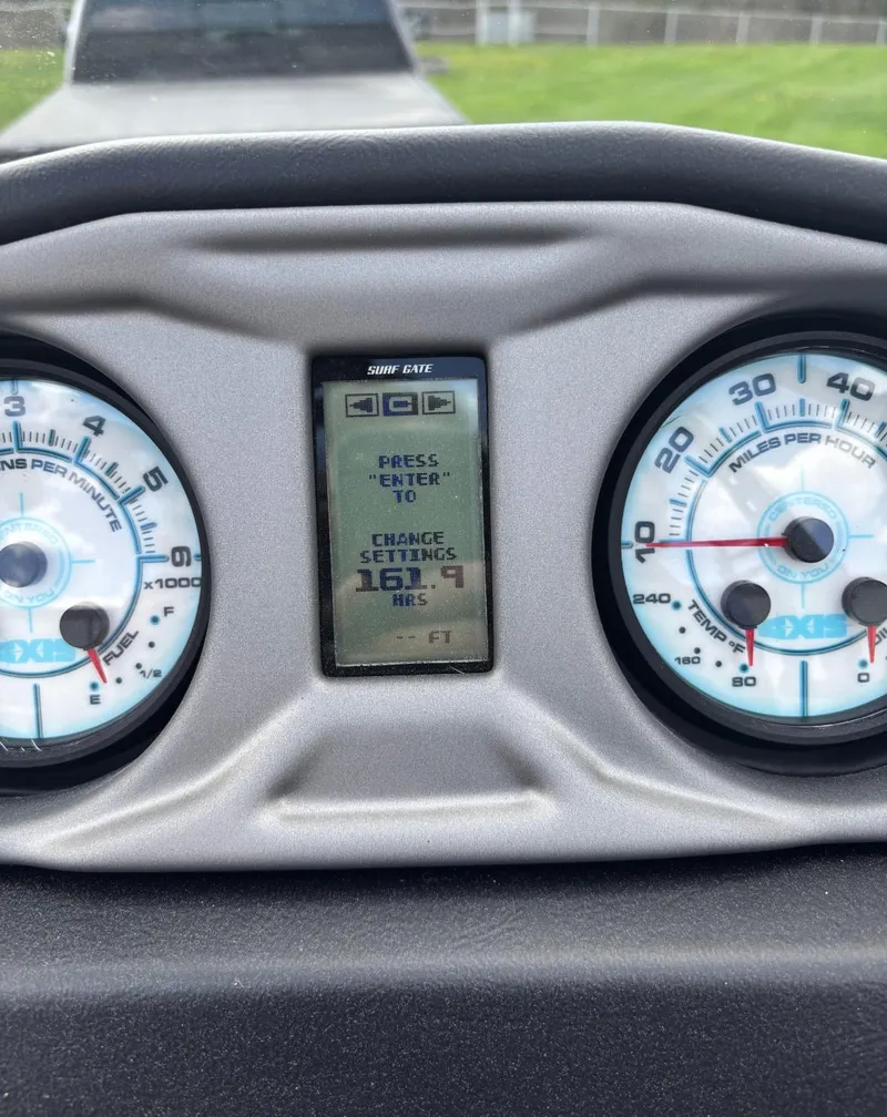 Slide: The Image of Dashboard of 2018 Axis T 22 boat with gauges and digital display. - 5
