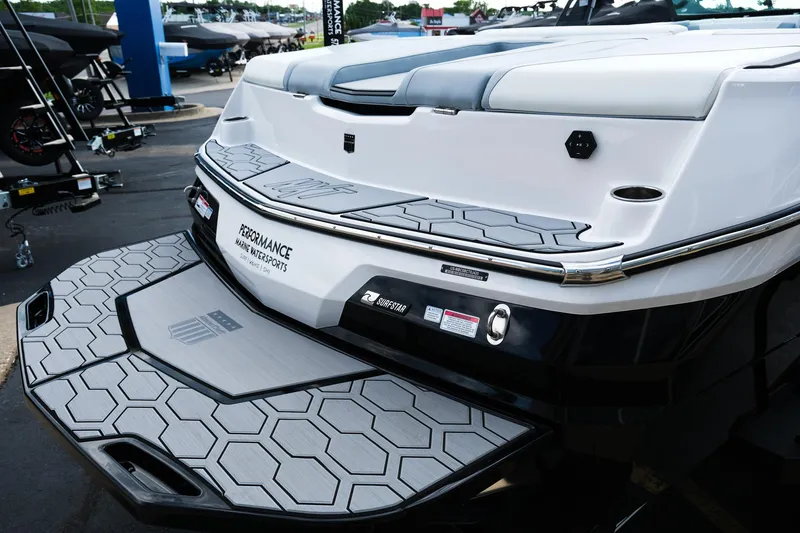 Slide: The Image of 2025 MasterCraft NXT24 boat rear view with hexagonal pattern deck. - 13