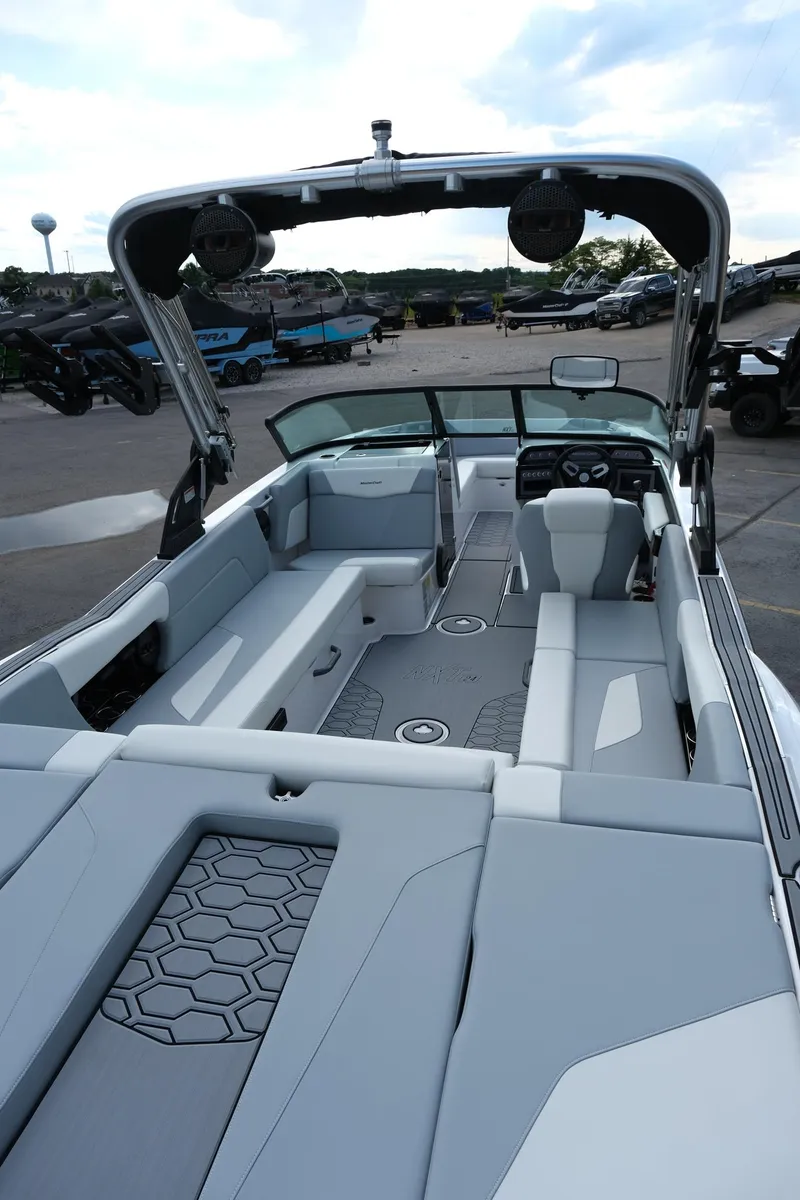 Slide: The Image of 2025 MasterCraft NXT24 boat interior with sleek seating and modern design. - 14