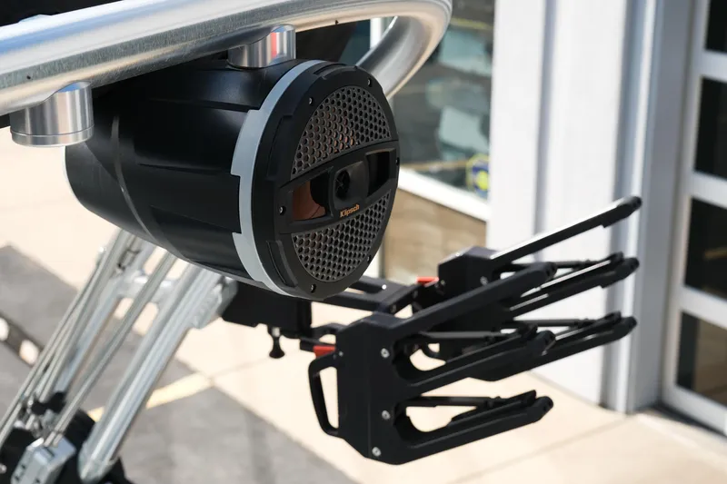 Slide: The Image of 2025 MasterCraft NXT24 boat speaker and wakeboard rack detail. - 19