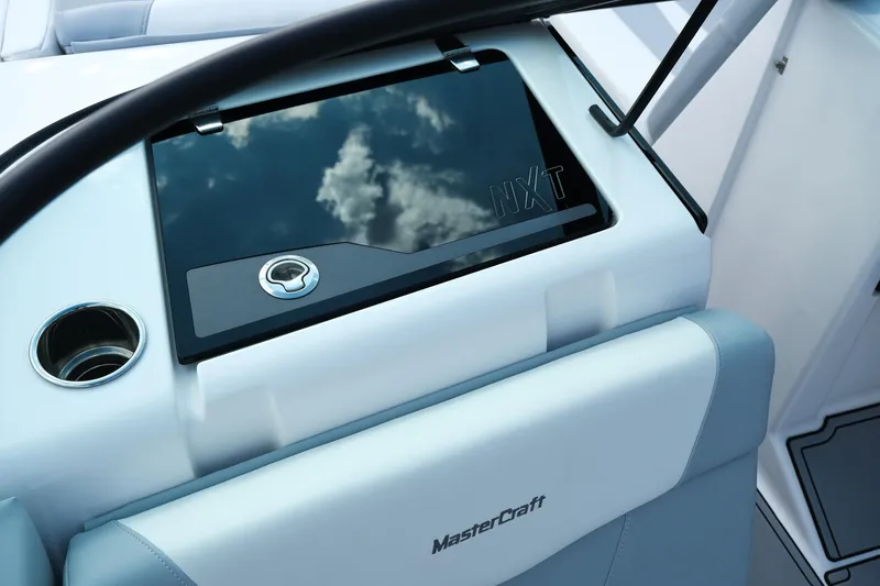 Slide: The Image of 2025 MasterCraft NXT24 boat dashboard with sleek design and modern features. - 24