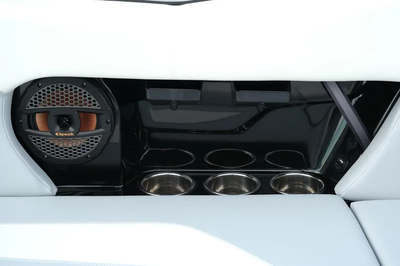 Slide: The Image of 2025 MasterCraft NXT24 interior with Klipsch speaker and cup holders. - 25