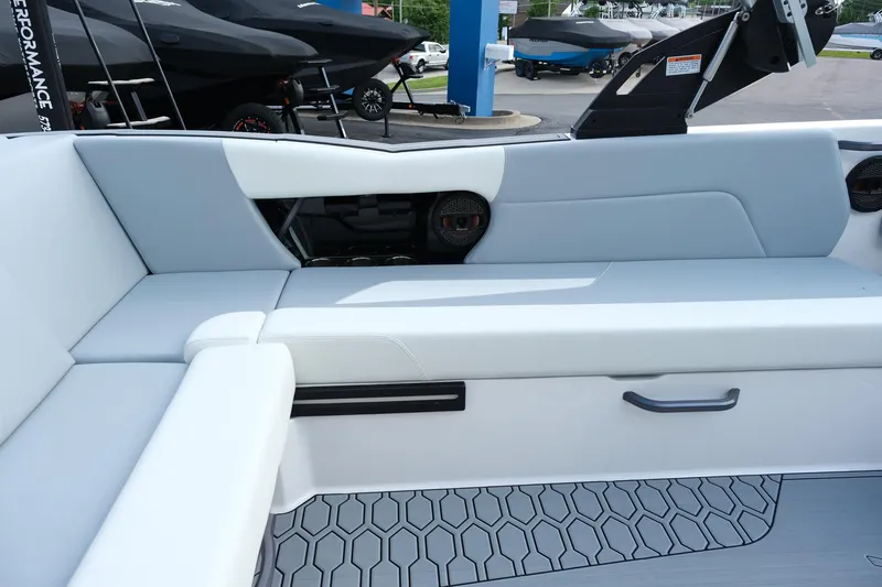 Slide: The Image of 2025 MasterCraft NXT24 boat interior with sleek seating and modern design. - 27