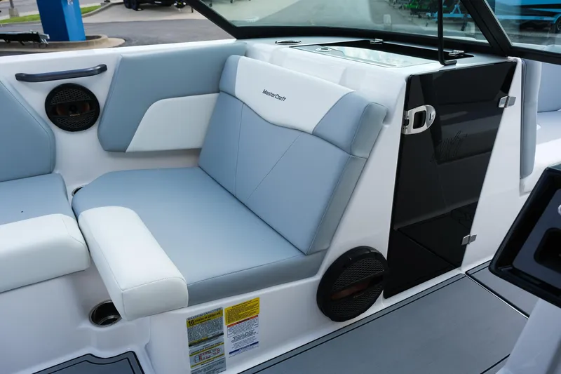 Slide: The Image of 2025 MasterCraft NXT24 boat interior with gray seating and modern design. - 30