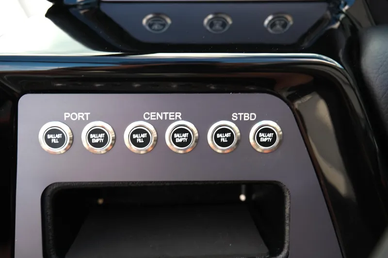 Slide: The Image of Control panel of 2025 MasterCraft NXT24 boat with ballast fill and empty buttons. - 33
