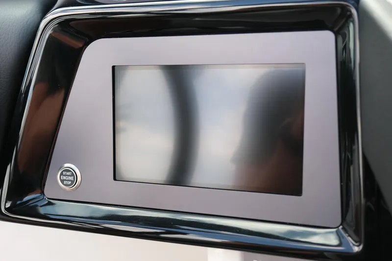 Slide: The Image of 2025 MasterCraft NXT24 dashboard with touchscreen and start button. - 34