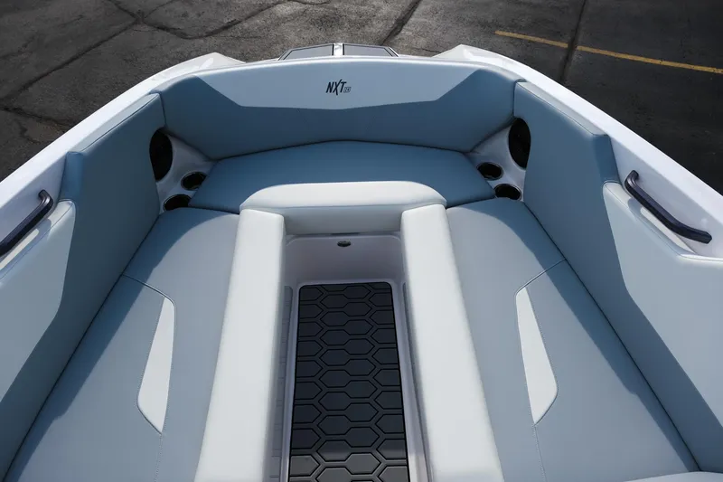 Slide: The Image of 2025 MasterCraft NXT24 boat interior with sleek seating and modern design. - 36