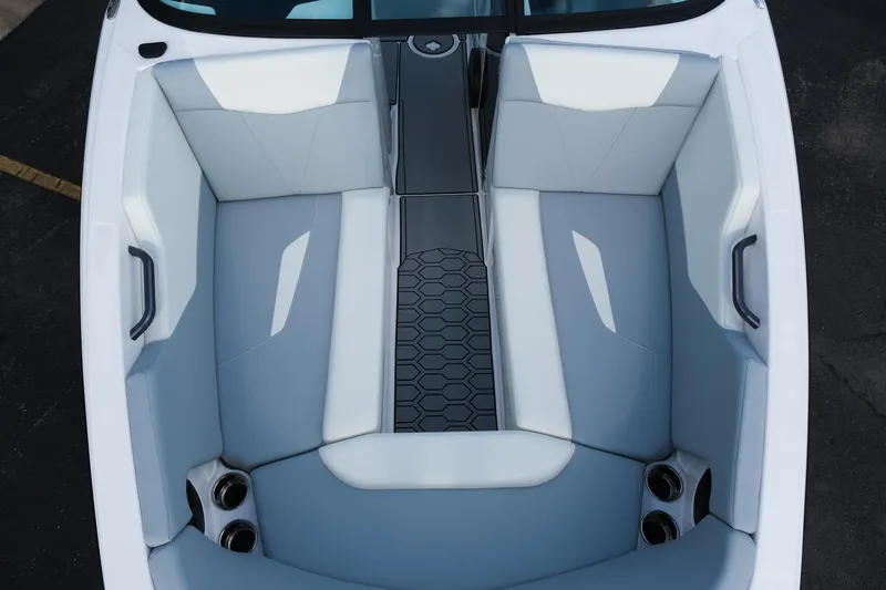 Slide: The Image of 2025 MasterCraft NXT24 boat interior with sleek seating and modern design. - 38