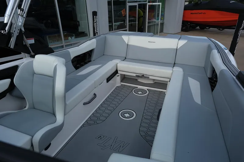 Slide: The Image of 2025 MasterCraft NXT24 boat interior with spacious seating and modern design. - 39