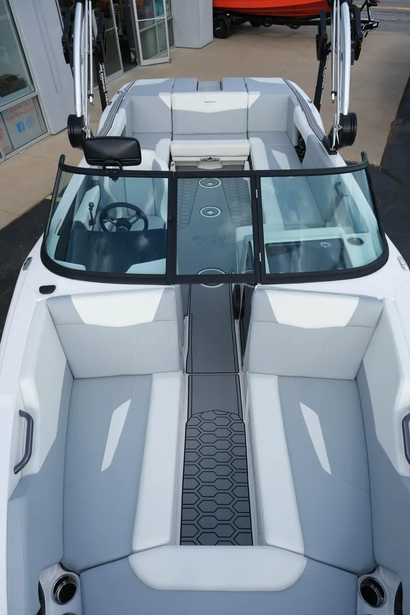 Slide: The Image of 2025 MasterCraft NXT24 boat interior with sleek seating and modern design. - 42