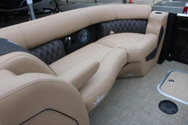 Slide: The Image of 2025 Barletta Lusso 23U boat interior with luxurious beige seating and elegant design. - 14