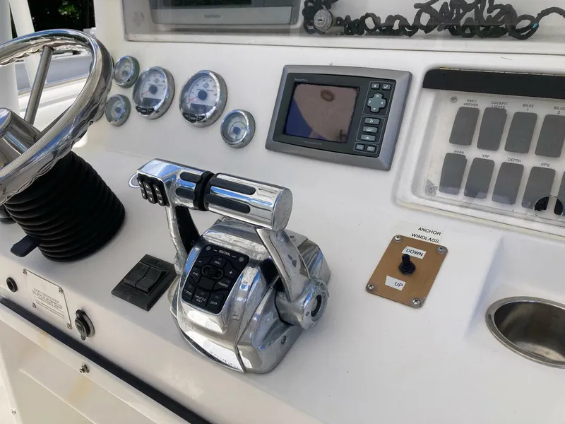 Slide: The Image of Control panel of a 2007 Marlago 35 boat with steering wheel and gauges. - 16