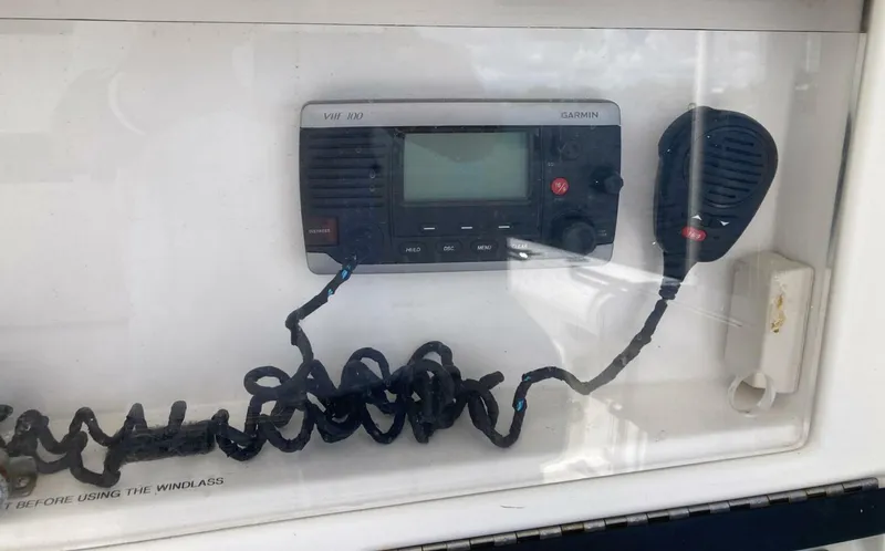 Slide: The Image of VHF radio system on a 2007 Marlago 35 boat, featuring a coiled microphone. - 19