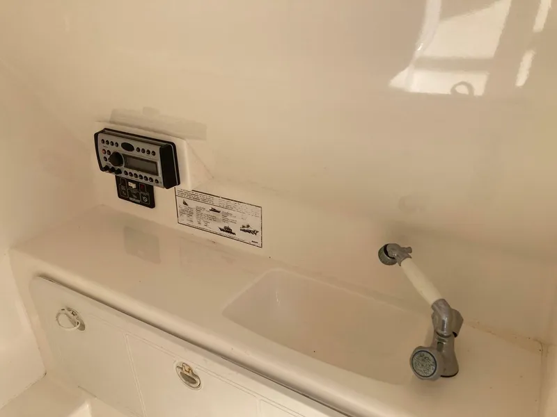 Slide: The Image of 2007 Marlago 35 boat interior with control panel and faucet. - 26