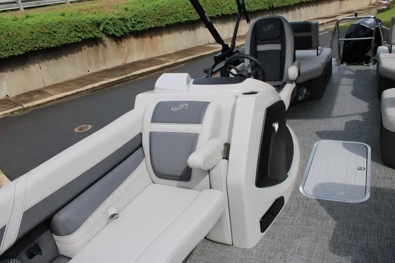 Slide: The Image of 2025 Barletta Cabrio 22M pontoon boat interior with gray seating and steering console. - 10