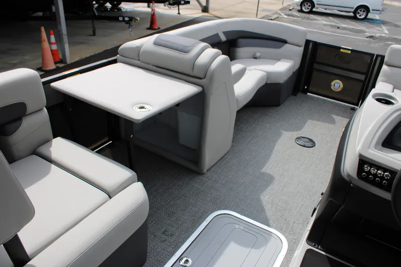 Slide: The Image of 2025 Barletta Cabrio 22M pontoon boat interior with seating and table. - 15