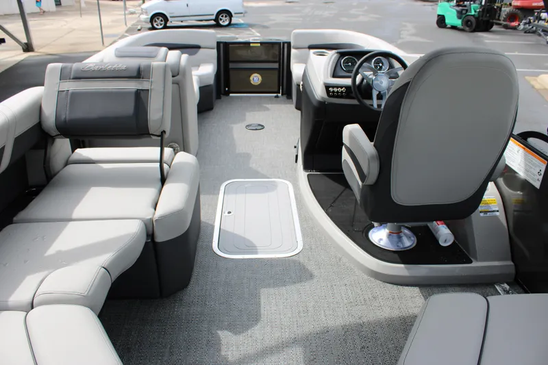 Slide: The Image of 2025 Barletta Cabrio 22M pontoon boat interior with gray seating and modern helm. - 9