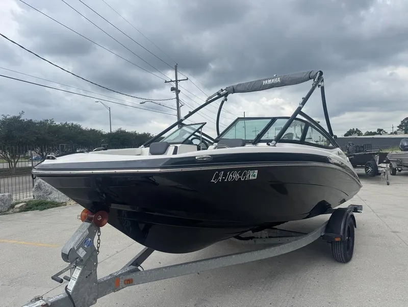 Slide: The Image of 2015 Yamaha AR190 boat on trailer under cloudy sky. - 4