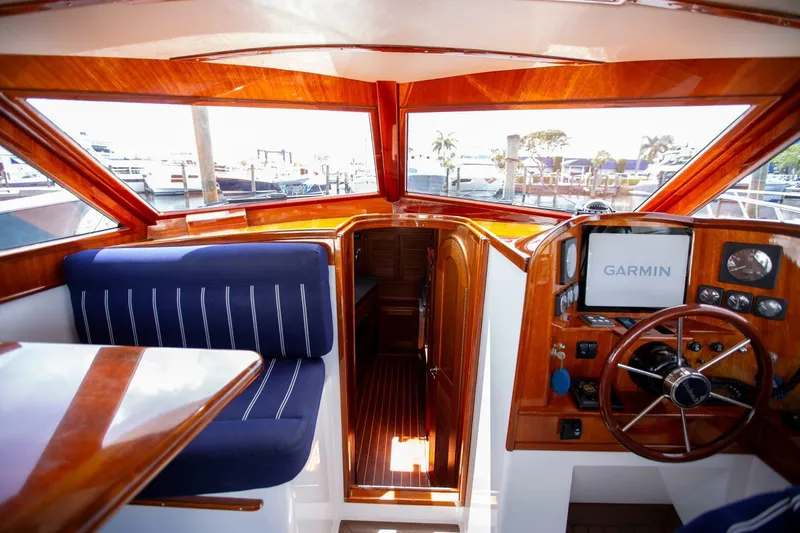 Slide: The Image of Interior of 2003 San Juan SJ 38 boat with Garmin navigation system and wooden finish. - 17