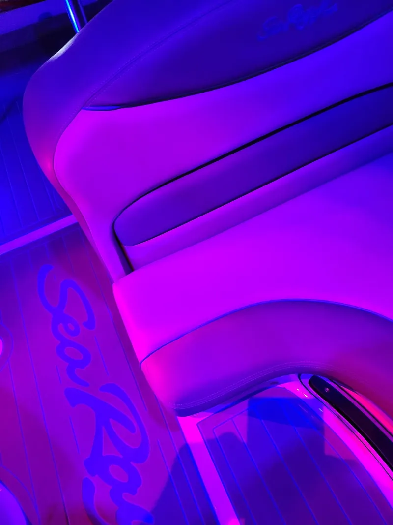 Slide: The Image of 2007 Sea Ray 280 Sundancer interior with vibrant purple lighting. - 14