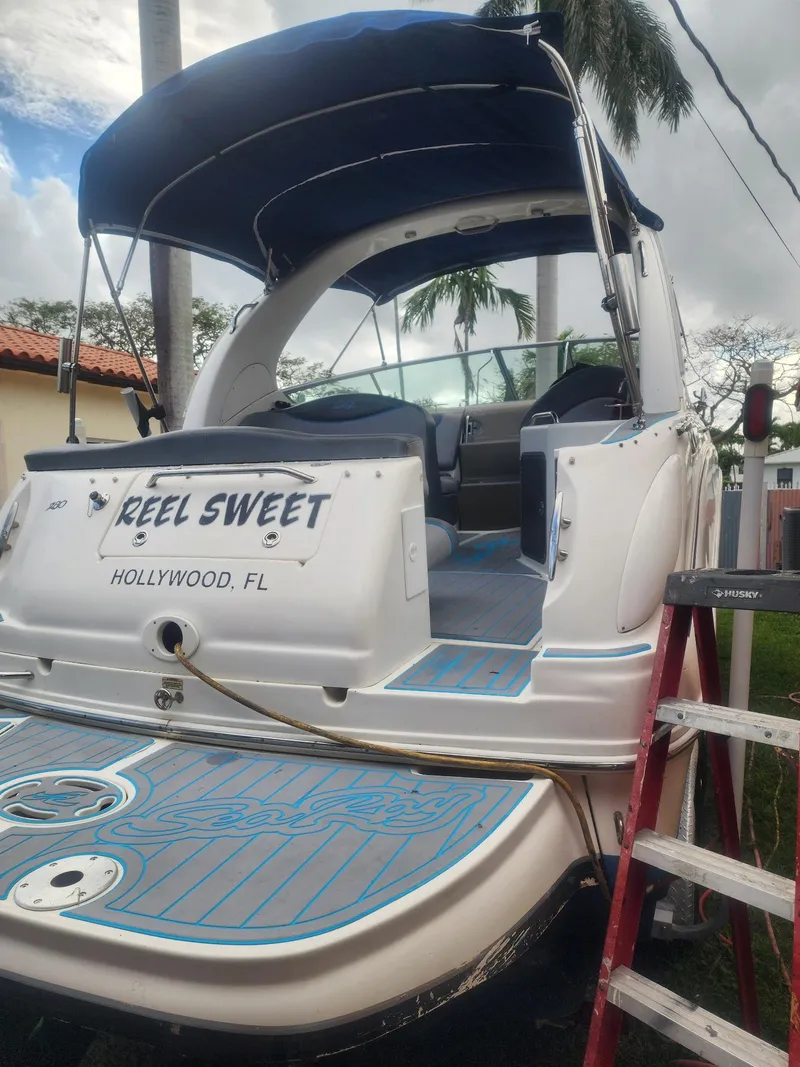 Slide: The Image of 2007 Sea Ray 280 Sundancer boat with blue canopy, docked in Hollywood, FL. - 5