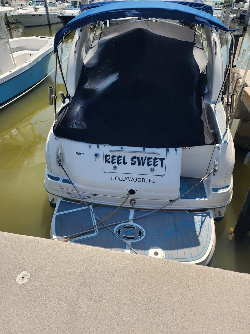 Slide: The Image of 2007 Sea Ray 280 Sundancer docked, named "Reel Sweet," in Hollywood, FL marina. - 6