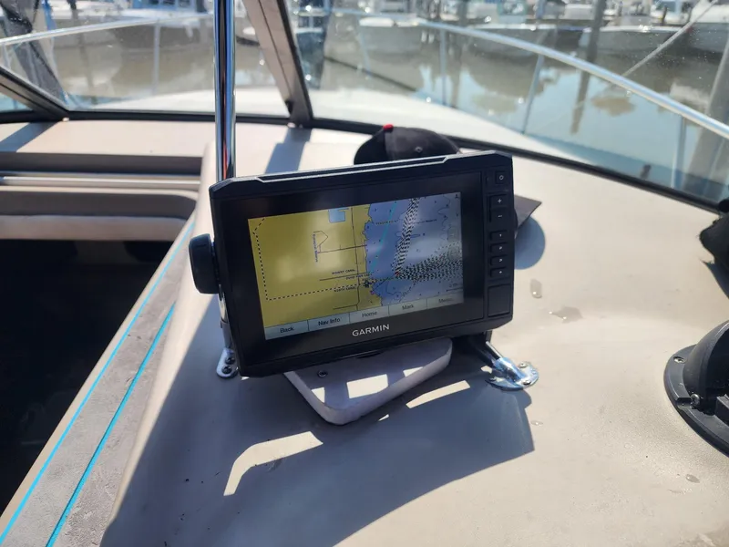 Slide: The Image of Garmin GPS on 2007 Sea Ray 280 Sundancer boat dashboard, marina background. - 9
