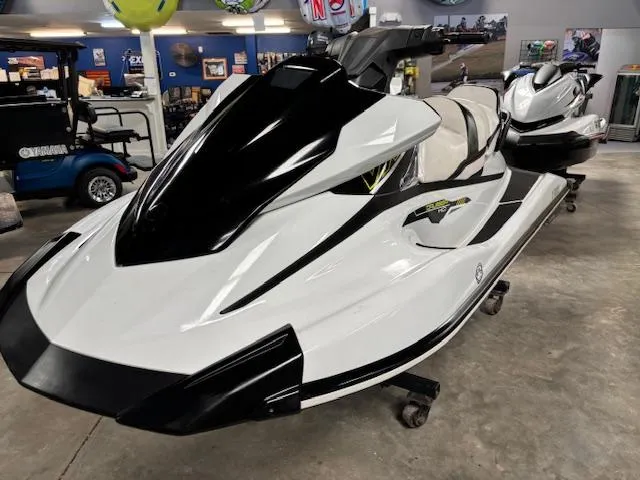 Slide: The Image of 2017 Yamaha WaveRunner VX Cruiser HO 1.8 in showroom, sleek white and black design. - 2
