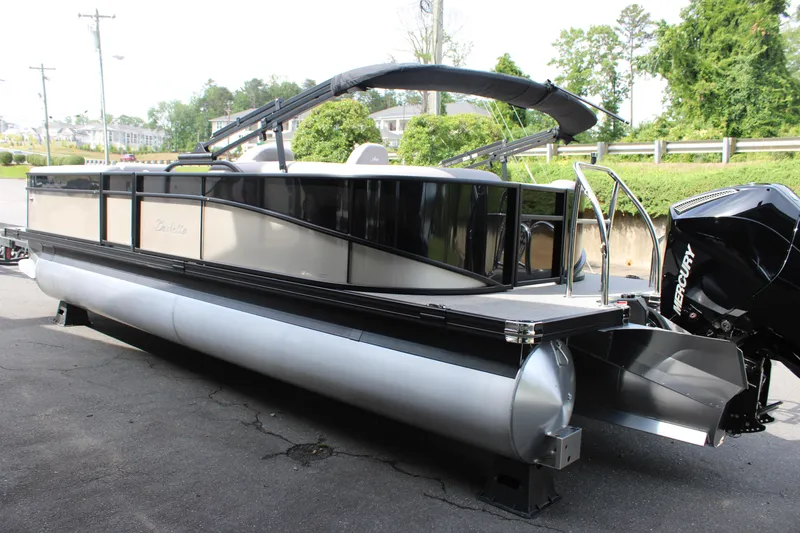Slide: The Image of 2025 Barletta Aria 24QC pontoon boat with sleek design and powerful Mercury engine. - 11