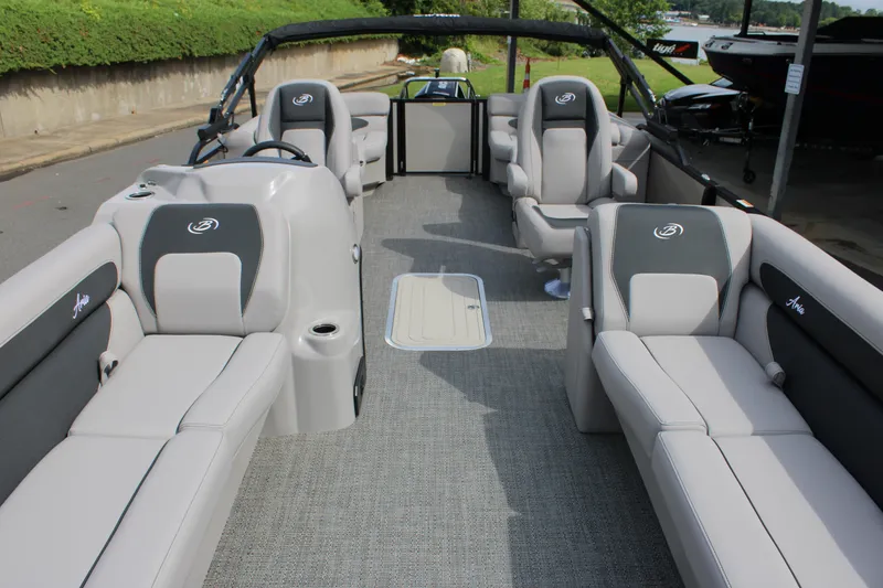 Slide: The Image of 2025 Barletta Aria 24QC pontoon boat interior with plush seating and modern design. - 17