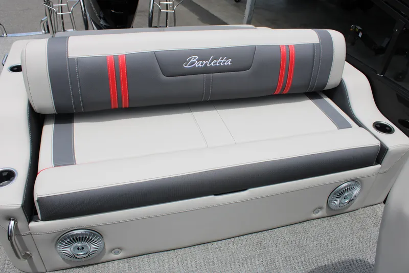Slide: The Image of 2025 Barletta Corsa 23UC boat seat with red accents and integrated speakers. - 20