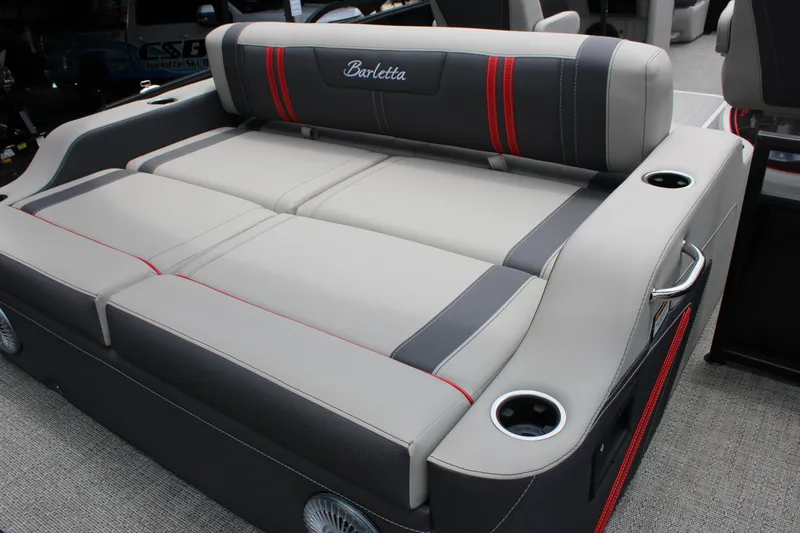 Slide: The Image of 2025 Barletta Corsa 23UC boat seating with cup holders and stylish upholstery. - 23