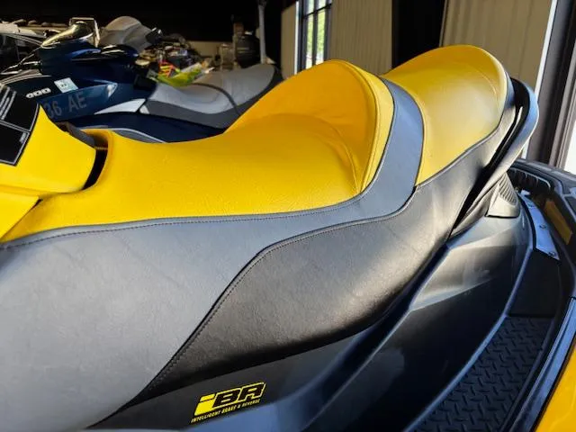 Slide: The Image of 2009 Sea-Doo RXT iS 255 jet ski with yellow and black seat design. - 4