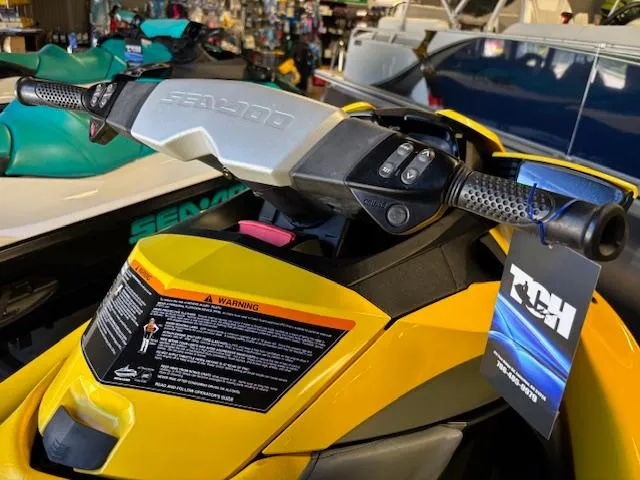 Slide: The Image of 2009 Sea-Doo RXT iS 255 jet ski, yellow, close-up of handlebars in showroom. - 7