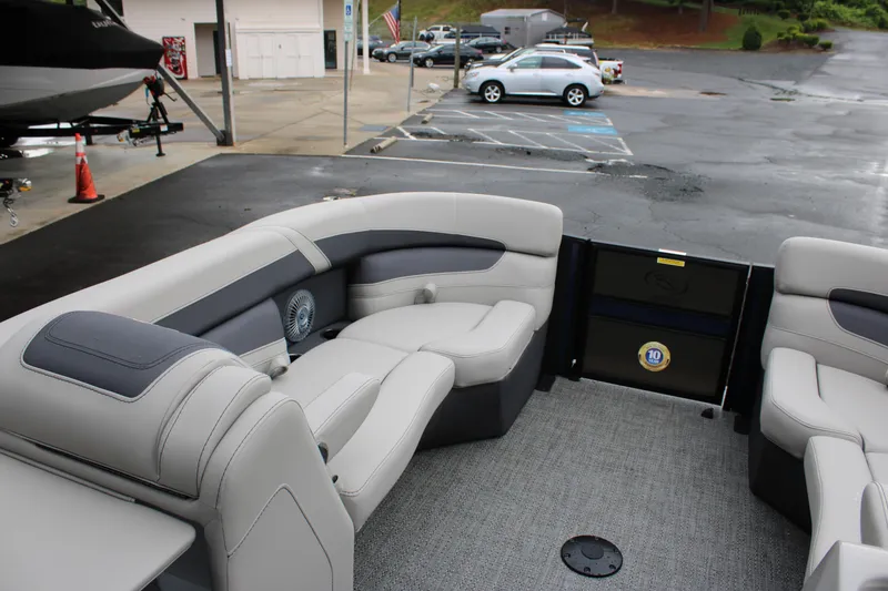 Slide: The Image of 2025 Barletta Cabrio 22QC pontoon boat interior with gray seating and carpeted floor. - 12