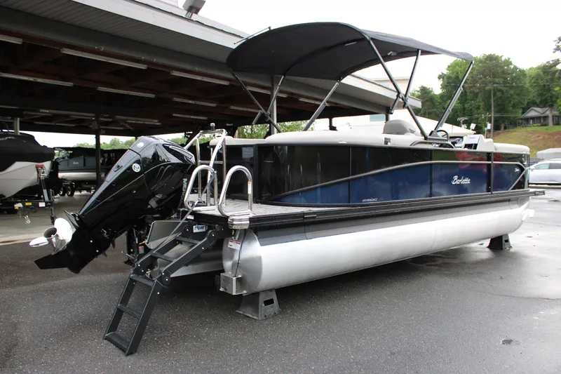 Slide: The Image of 2025 Barletta Cabrio 22QC pontoon boat with canopy and outboard motor. - 3