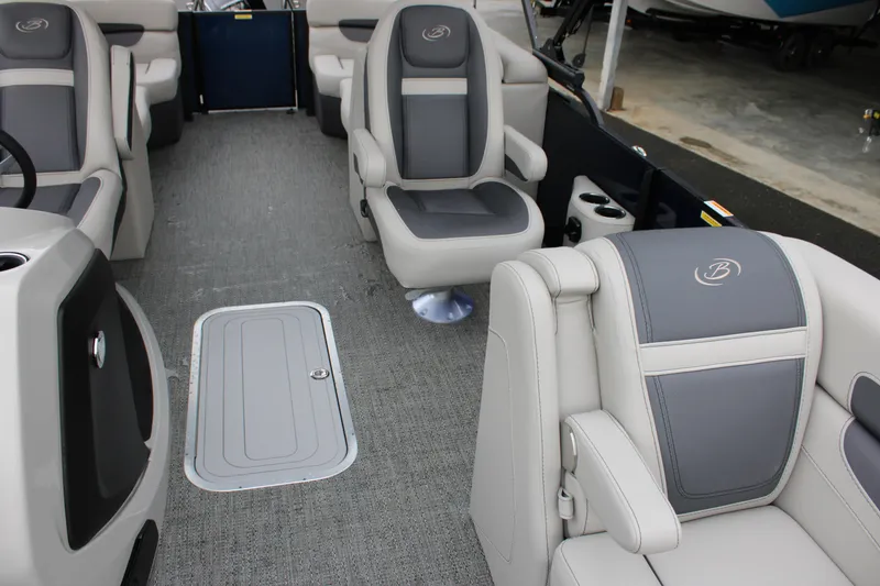 Slide: The Image of 2025 Barletta Cabrio 22QC interior with gray seating and carpeted flooring. - 8