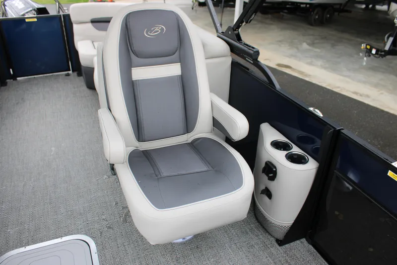 Slide: The Image of 2025 Barletta Cabrio 22QC boat interior with gray captain's chair and cup holders. - 9