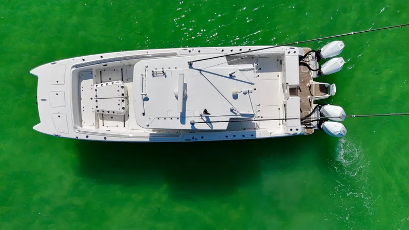 Slide: The Image of Aerial view of 2022 World Cat 400 CC-X boat on vibrant green water. - 11
