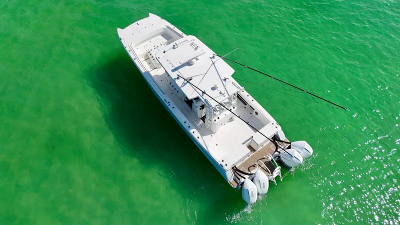 Slide: The Image of Aerial view of 2022 World Cat 400 CC-X boat on clear green water. - 12