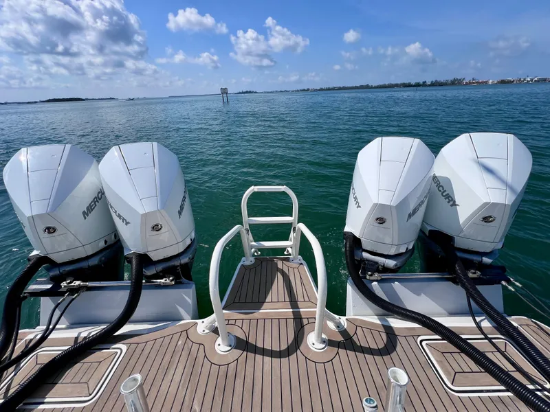 Slide: The Image of 2022 World Cat 400 CC-X boat with quad Mercury engines on open water. - 15