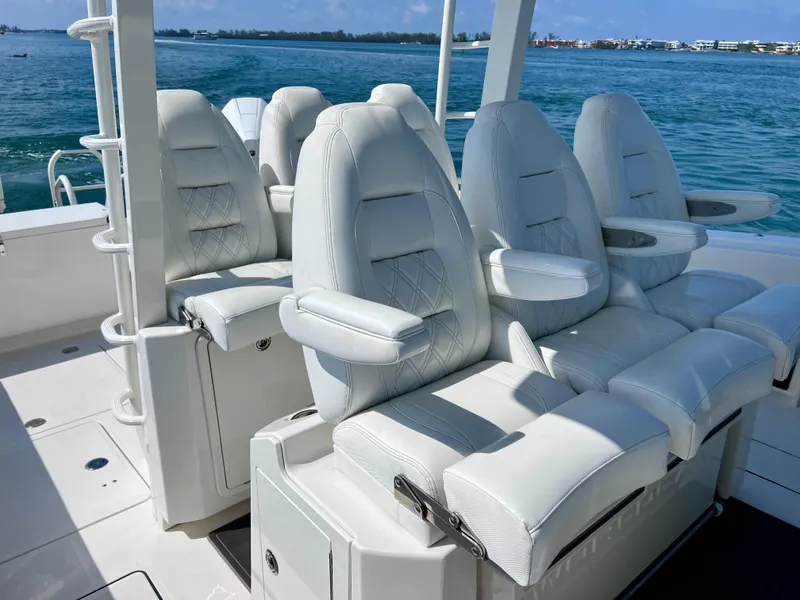 Slide: The Image of Luxurious seating on 2022 World Cat 400 CC-X boat, featuring white leather upholstery. - 27