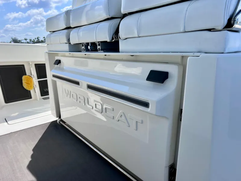 Slide: The Image of 2022 World Cat 400 CC-X boat interior with cushioned seating and sleek design. - 29