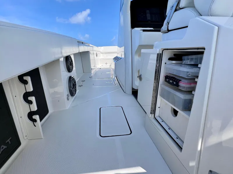 Slide: The Image of 2022 World Cat 400 CC-X boat interior with storage compartments and sleek design. - 31