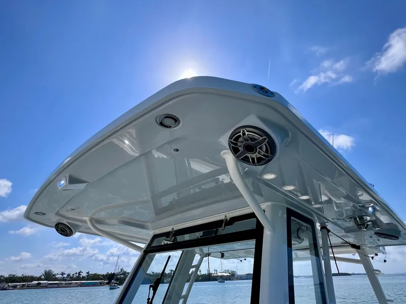 Slide: The Image of 2022 World Cat 400 CC-X boat roof with speakers, under clear blue sky. - 39