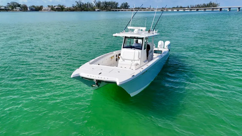 Slide: The Image of 2022 World Cat 400 CC-X boat on turquoise water, featuring night vision and joystick controls. - 4